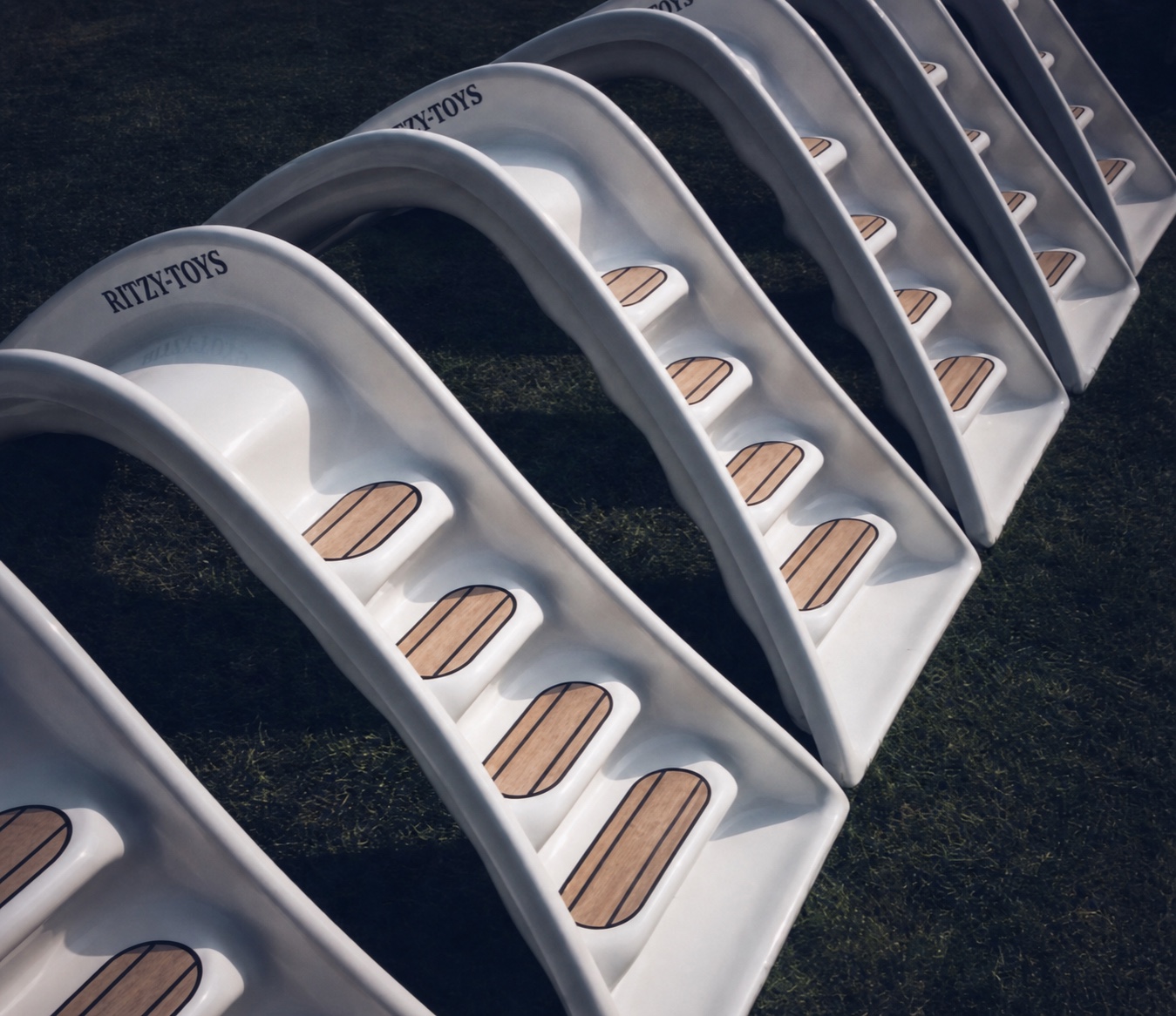 A series of pearl-white Ritzy-Slides in production