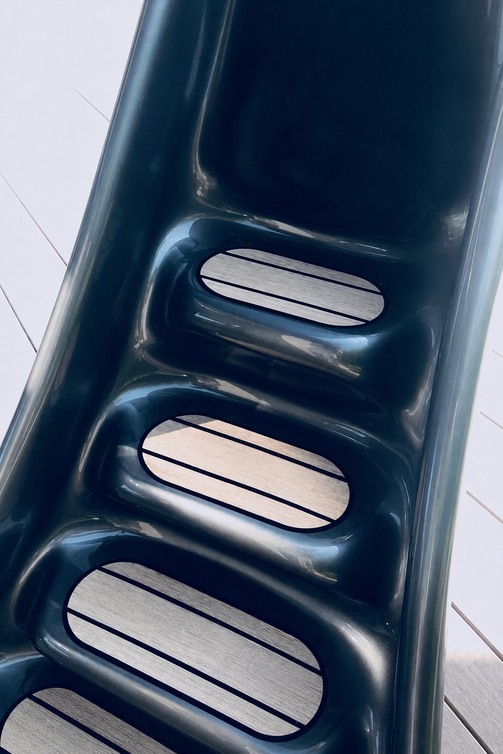 Detail of the integrated stair surfaces on a dark Ritzy-Slide